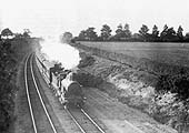 An unknown GWR 2-2-2 locomotive, thought to be No 999 'Sir Alexander', approaches Solihull in 1898