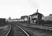 GWR 2-8-0 28xx class No 2848 passes Southam Road and Harbury Signal Box with an Up �Class H� through heavy freight train