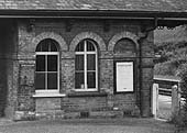 Close up  of the main station building with the station master's office protected by iron bars at the window