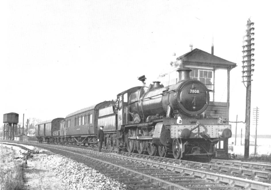GWR 4-6-0 No 7808 Cookham Manor in British Rail livery with the Tyseley Breakdown Train waiting at Stratford on Avon East Box