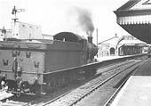 Ex-GWR 0-6-0 2251 class No 2238 is seen coasting through the station on the up main in preparation for another banking duty in the early 1950s