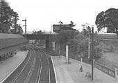 Looking south towards Honeybourne from the passenger footbridge showing the water tank and refuge siding on the other side of Alcester Road bridge
