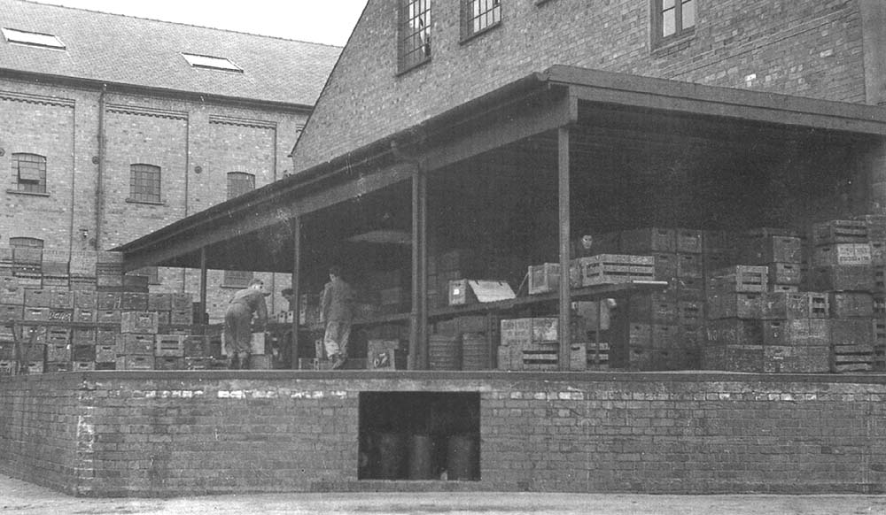View of Flower & Sons Ltd's loading deck for barralled beer moved by road transport as seen from the main road entrance to the brewery