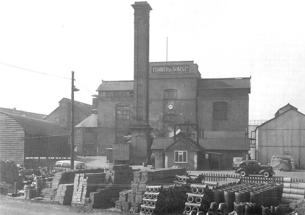 View of Flower & Son Ltd's brewery shed and boilerhouse and chimney seen from the back of Stratford on Avon station's goods yard
