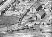 Close up of Flower & Sons sidings, the barley house and bottling plant with the GWR's water tank at the throat to the yard to the front