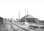 Looking towards Birmingham Road with the original 1863 station turned goods shed on the right and Flowers Brewery beer shed on the left