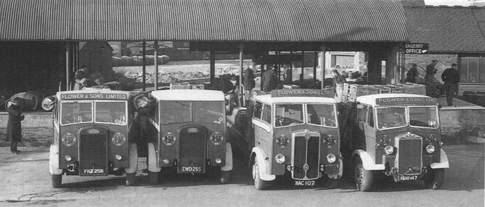 Flower & Son Ltd's lorries standing in line with empty cases ready to take their turn in collecting bottled beer for local distribution