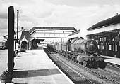 Ex-GWR 2-8-0 28xx class No 2883 is seen passing through the station on a down working to the Severn Tunnel Junction on 16th August 1958
