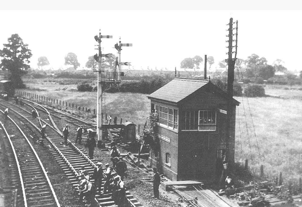 The Engineers Department's Permanent Way gang are seen replacing track adjacent to Stratford on Avon West Signal Box one Sunday in 1935