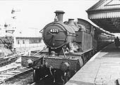 Ex-GWR 2-6-2T 45xx class 'Prairie' No 4571 is seen standing at the down platform at the head of a local passenger service