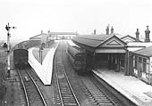 View of Stratford on Avon station with a local passenger service standing at Platform Three and a single-coach Auto-train at Platform One