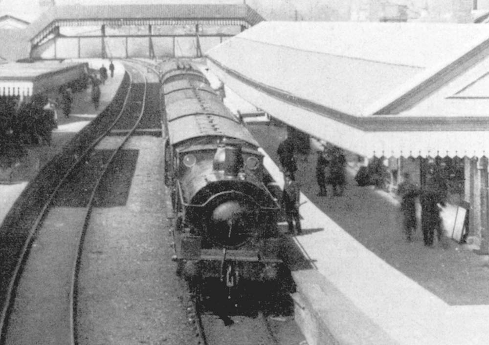 Close up showing an unidentified GWR 0-6-0ST 'Dean Saddle Tank' standing at the down platform on a local passenger service to Honeybourne