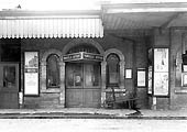 View of the entrance to the Parcels Office from the down platform showing the triangular sign suspended above the doorway