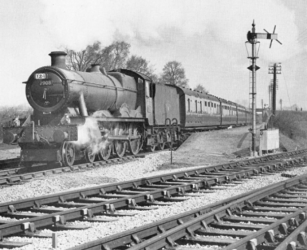 Ex-Great Western Railway 4-6-0 49xx Hall class No 7908 'Henshall Hall' passes Stratford-on-Avon Racecourse Halt on 14th April 1960