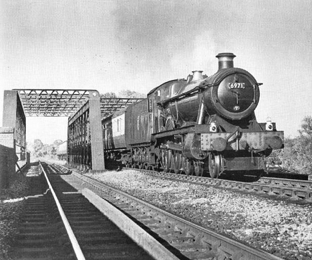 Ex-Great Western Railway 4-6-0 49xx ‘Hall’ class No 6971 ‘Athelhampton Hall’ crossing the lattice girder bridge adjacent to Stratford-upon-Avon Racecourse
