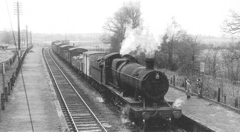 Ex-Great Western Railway 2-8-0 28xx class No 3865 on a class F express freight heading North through Stratford Racecourse on Sunday 30th January 1960