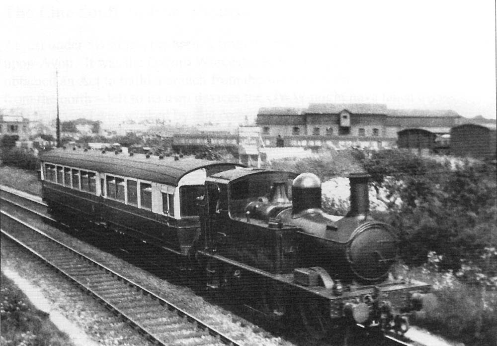 GWR 0-4-2T 14xx Class No 4825, with auto-coach attached, is seen passing benearth the SMJ bridge in 1933