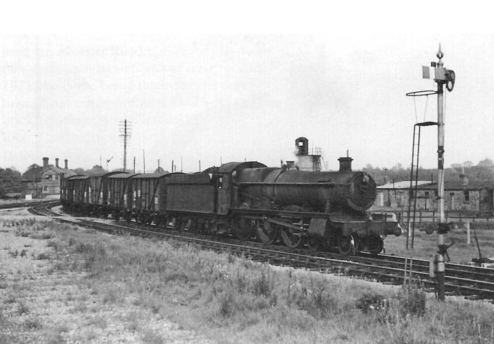 Ex-GWR 4-6-0 No 6944 'Fledborough Hall' enters the New Curve Junction line with a train of empty banana vans on 23rd May 1964