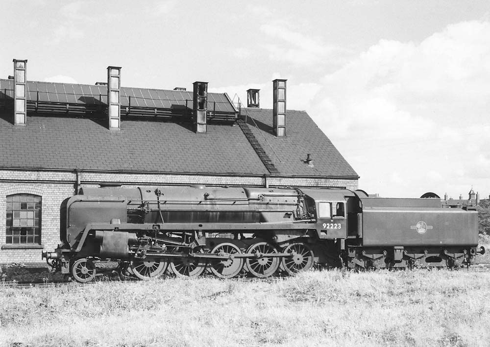 British Railways 2-10-0 Standard Class 9F No 92223 is seen standing dead outside Stratford on Avon shed on 16th August 1958