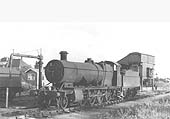 Ex-GWR 2-8-0 No 2879 stands in front of the shed adjacent to the water column on 16th August 1959