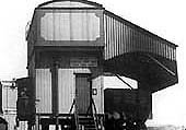 Close up showing the side of the combined coaling stage and water tank with a wagon placed to coal the next engine