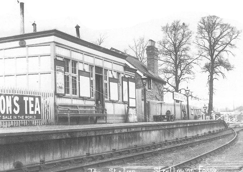 Close up showing the point rodding running in front of the station before passing beneath the platform wall