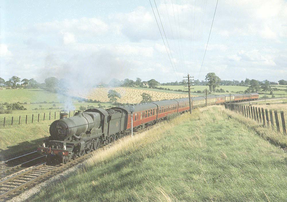 British Railways built 4-6-0 Castle class No 7014 'Caerhays Castle' is seen on an up West of England express service approaching the Lakes Halt