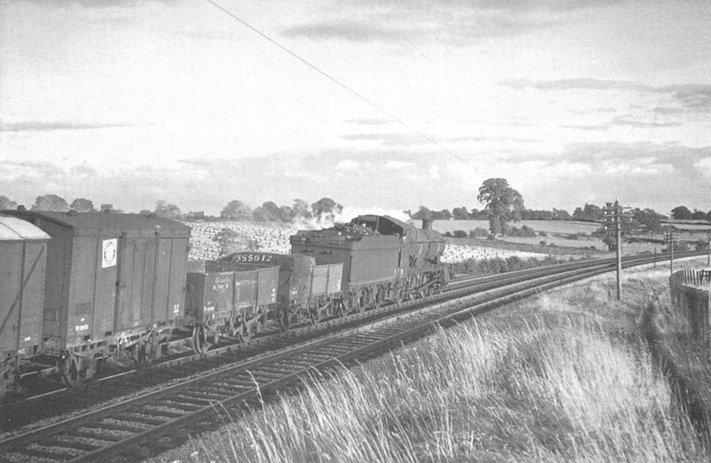 Ex-GWR 4-6-0 Grange class No 6834 'Dummer Grange' is seen just south of The Lakes Halt whilst at the head of an up freight on 25th August 1962