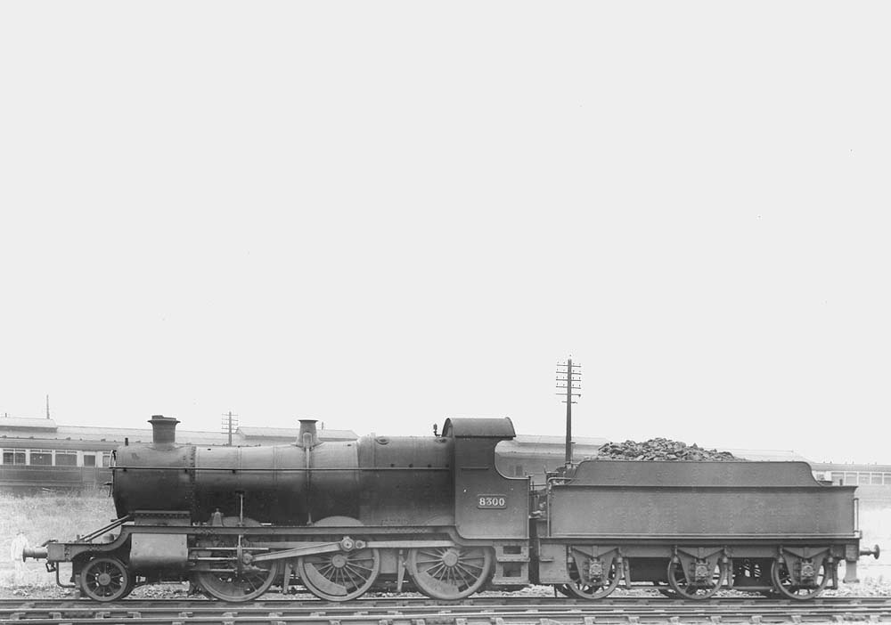 GWR 2-6-0 No 8300, the first of several 43xx class locomotives modified, is seen standing in front of Tyseley's carriage sidings