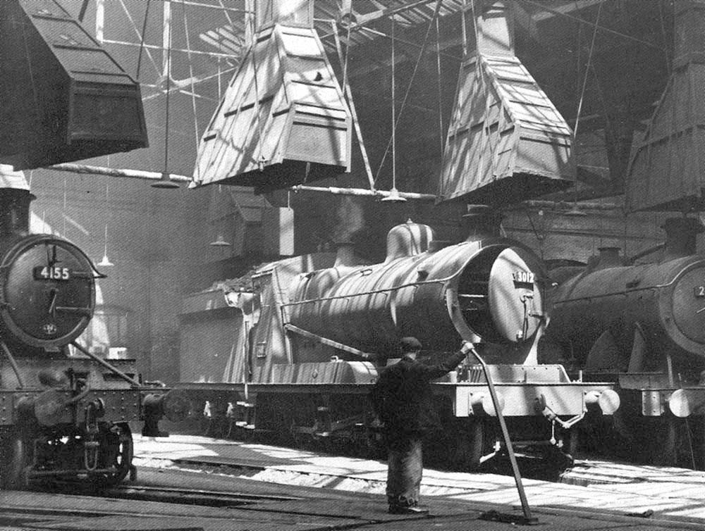 View of one of the roundhouses at Tyseley shed with ex-GWR 2-6-2T No 4155, ex-ROD 2-8-0 No 3012 and ex-GWR 2-8-0 No 2856 in view