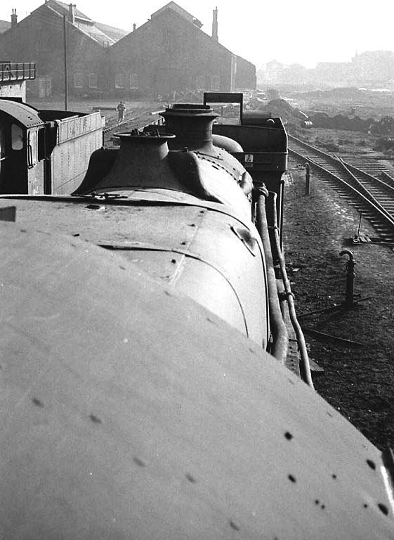 Looking along a line of withdrawn locomotives standing in line at Tyseley shed on 31st January 1965