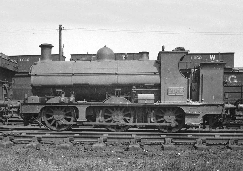 Great Western Railway 0-6-0ST 1901 Class No 2005 is stabled on one of Tyseley shed's roads alongside the coaling stage
