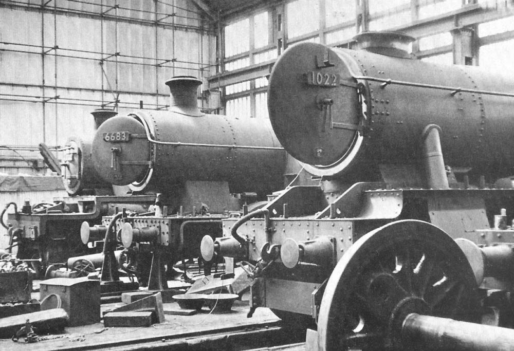 Several GWR locomotives undergoing maintenance inside the Tyseley Repair Shop in May 1959