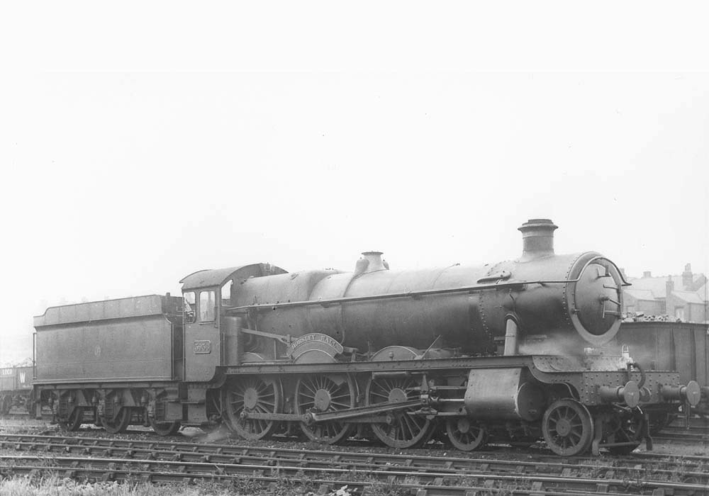 GWR 4-6-0 Hall class No 5956 'Horsley Hall' with steam gently escaping stands on one of Tyseley shed's stabling roads