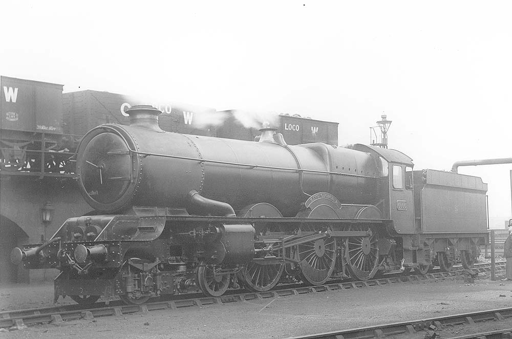 GWR 4-6-0 King class No 6006 'King George 1' is seen standing on one of tTyseley shed's coaling roads as it takes on water