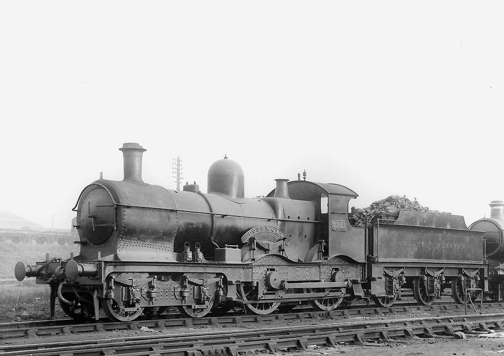 GWR 4-4-0 No 3281 'Cotswold', a curved outside-framed Duke class locomotive, is seen standing outside Tyseley shed