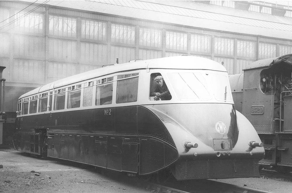 GWR Railcar No 2 is seen with its side panel removed to provide access to the engine as it stands in front of Tyseley's Repair Shops