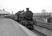 Ex-GWR 4-6-0 'Modified Hall' class No 6964 'Thornbridge Hall' is seen at the head of the 11 58am Banbury OIC to Bilston iron ore train on 15th February 1965