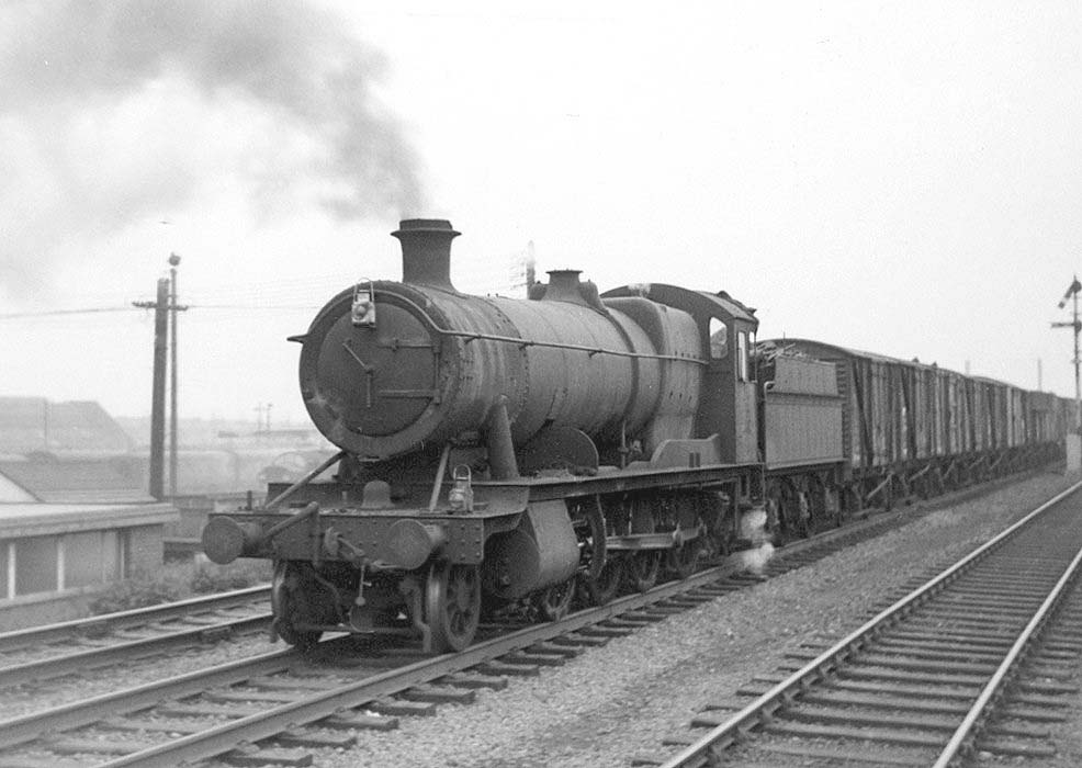 Ex-GWR 2-8-0 28xx class No 3859 is seen at the head of the up 10 50 am Bordesley to Banbury freight service on 15th February 1965