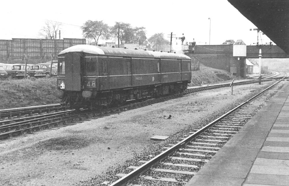 A British Railways Diesel Parcels Car is seen passing through Tyseley on an up parcels service in October 1966