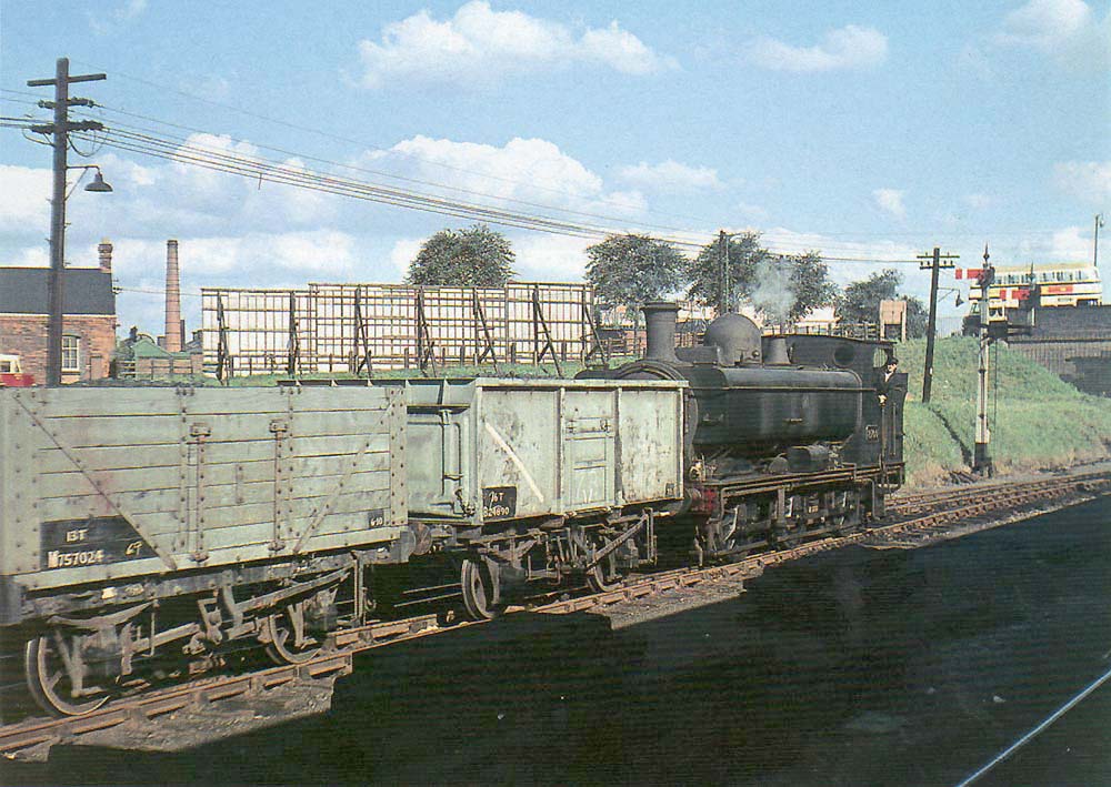 Another view of ex-GWR 0-6-0PT 57xx Class No 8700 shunting a rake of coal wagons into Tyseley goods yard in 1958