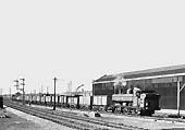 Ex-GWR 0-6-0PT 57xx Class No 8700 hauls a rake of wagons along the up main with a train from Bordesley Junction in 1958