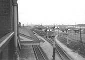 View looking towards Birmingham of the goods yard from Wharfdale Road bridge as an unknown ex-GWR 0-6-0 Pannier tank engine shunts in the goods yard