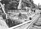 A JCB 3c excavates one of Wharf Street's bridge abutments over the week end of 5th and 6th July 1975