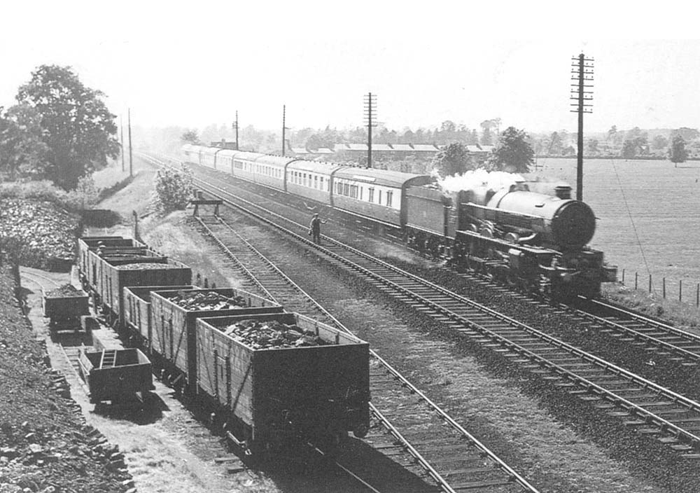 GWR 60xx Class 4-6-0 No 6008 'King James II' rushes past the Gas Works siding on an up named express