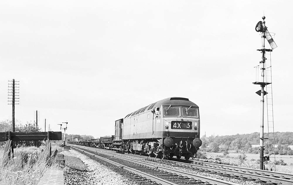 A British Railways Sulzer Type 4 Bo-Bo diesel locomotive is seen on an up permanent way train in September 1966