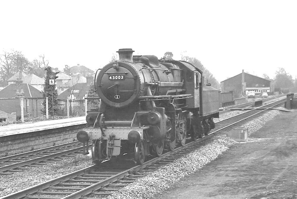 British Railways built 4MT 2-6-0 No 43003 runs light engine through Warwick station on 3rd April 1965