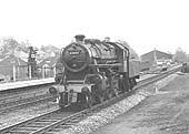 British Railways built 4MT 2-6-0 No 43003 runs light engine through Warwick station on 3rd April 1965
