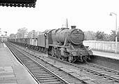 Ex-LMS 8F 2-8-0 No 48412 is seen at the head of a Class F unfitted up express goods on 5th October 1963