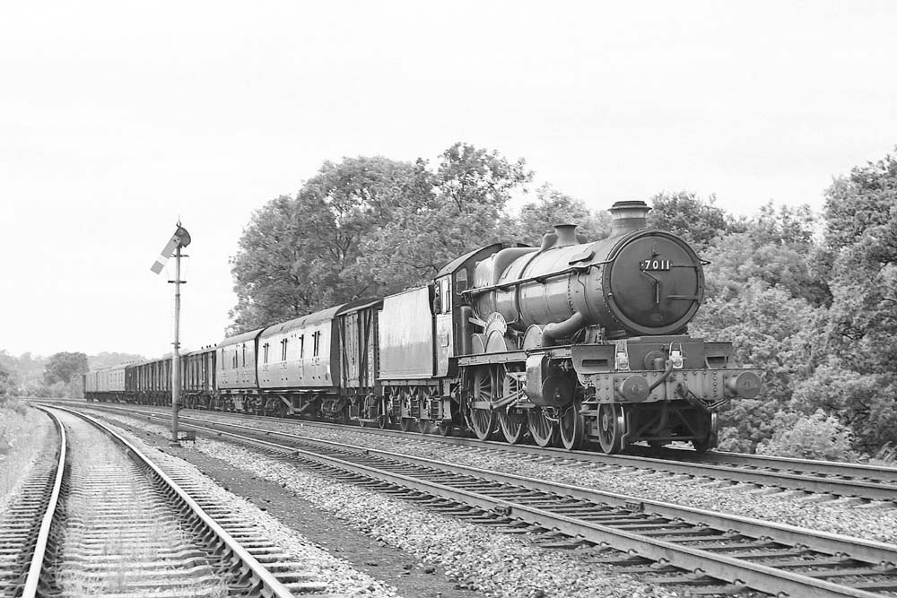 British Railways built 4073 Class 4-6-0 No 7011 'Banbury Castle' passes Budbrook with a Shrewsbury to Paddington parcels train on 15th August 1964